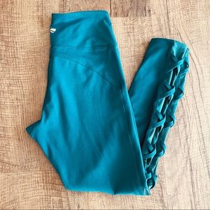 Marika Teal leggings Crisscross sides with mesh, woman’s size medium in VGUC